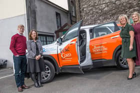 Angela Hayes and Alan Hayes, Teac Tom accepting the sponsored jeep from Theresa Ryan and Bronagh Fleming, Boston Scientific Employee Charity before the Teac Tom Business lunch in Butler House