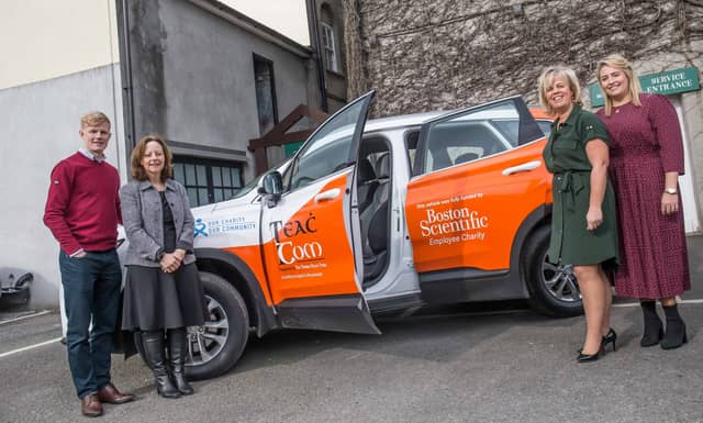 Angela Hayes and Alan Hayes, Teac Tom accepting the sponsored jeep from Theresa Ryan and Bronagh Fleming, Boston Scientific Employee Charity before the Teac Tom Business lunch in Butler House