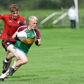 Aaron McTiernan on the attack for Ardagh Moydow with Cashel defender Aidan Mulvihill in pursuit. Action from the IFC Round 3 clash at Leo Casey Park on Sunday Photo: Syl Healy