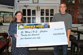 Michael Mulvey representing the Runners v Riders fundraising group presented a cheque for €22,500 to the Principal of St Mary’s NS in Cloghan, Valerie Daly. Pic: Rose Mannion.