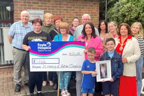Family and friends pictured presenting the cheque in memory of Kathleen to the Foyle Hospice.
