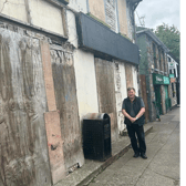 Cllr Pearse McGeough at building set to be re-developed in Castlebellingham