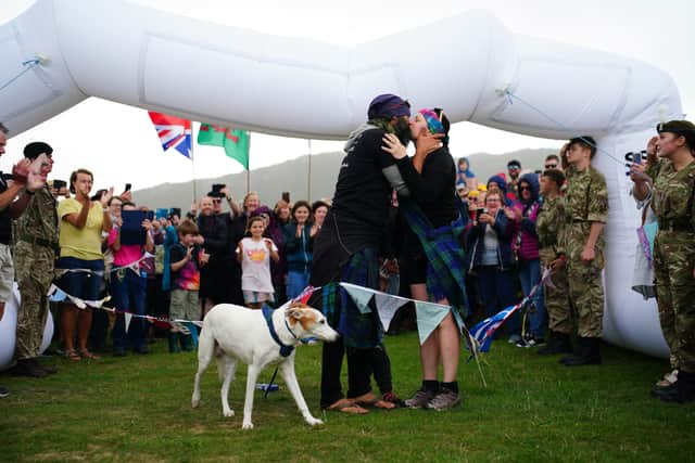 The couple welcomed their first child, a baby boy named Magnus Lewis, in May last year. He walked across the finish line, through bunting made by wellwishers from across the world, with his parents.