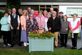 Brian King ( CEO Thurles Credit Union ) and Amanda Ryan ( Chairperson Thurles Credit Union) with Moyne Road Residents last week to celebrate the arrival of the 8 new planters.