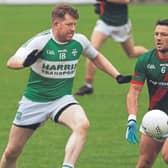 Milltown Colin O'Shea lays off his pass as Castlemitchell Declan McKenna tries to apply some pressure in the Top Cross JFC. Photo: Sean Brilly