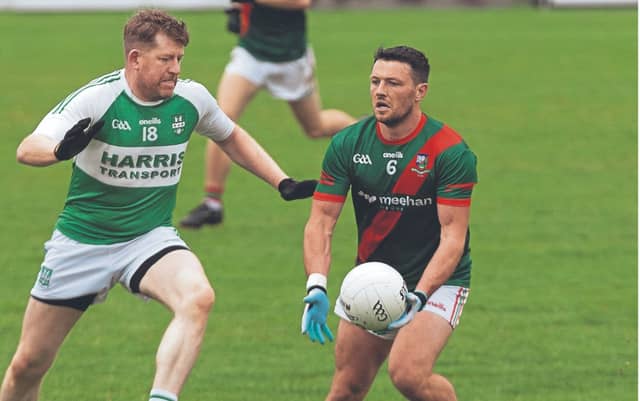 Milltown Colin O'Shea lays off his pass as Castlemitchell Declan McKenna tries to apply some pressure in the Top Cross JFC. Photo: Sean Brilly