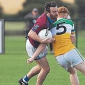 Rheban John Morrisey tries to go past the challenge of Robertstown Dara Cosgrave during Group A of the Junior Football Championship game played at Hawkfield