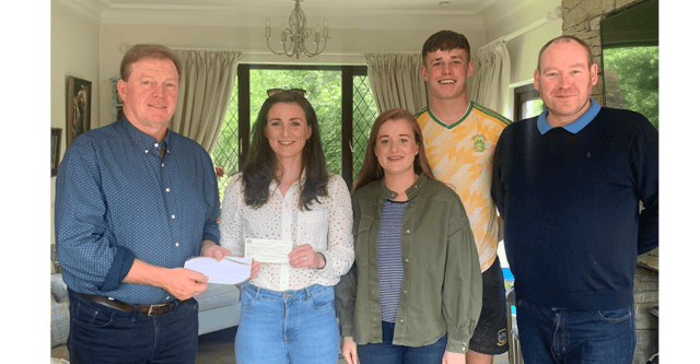 Noirin Forrestal hands over a cheque on behalf of the pupils at St Olivers National School Clonmel to Declan Ryan for the Dillon Quirke Foundation