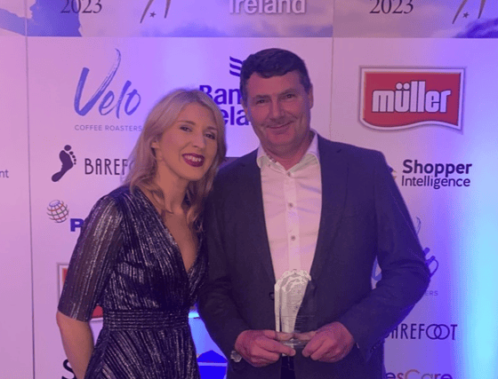 Aldi store manager, Shane Mellett collecting his award from Emma Cahill, Brand Director at Glenhaven Foods