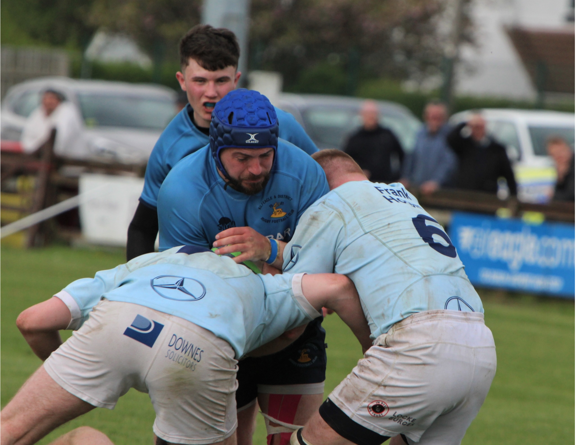 Photo from the recent Munster Junior Cup final v Garryowen played in Limerick. Kilfeacle's Keith Bourke takes on two Garryowen players. Luke Heuston awaits developments.