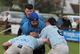 Photo from the recent Munster Junior Cup final v Garryowen played in Limerick. Kilfeacle's Keith Bourke takes on two Garryowen players. Luke Heuston awaits developments.
