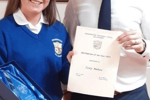 Izzy Maher,  winner of Ballingarry Secondary School sportsperson of the year Award 2023 pictured here being presented with her award by Mr. Egan.