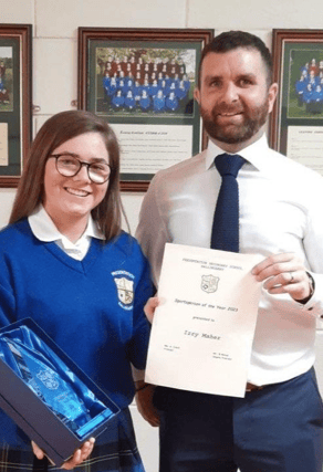 Izzy Maher, winner of Ballingarry Secondary School sportsperson of the year Award 2023 pictured here being presented with her award by Mr. Egan.