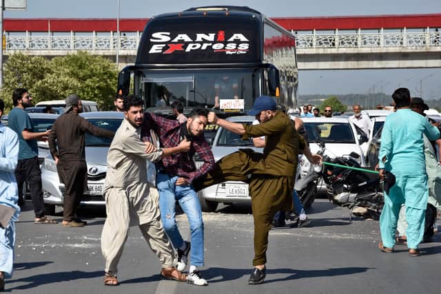 Speaking on Wednesday morning, police said at least 2,000 protesters were still surrounding the fire-damaged residence of Lieutenant General Salman Fayyaz Ghani, chanting slogans including “Khan is our red line and you have crossed it”.