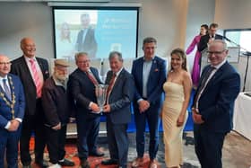 JP McManus, centre, accepted the award on behalf of the organising committee