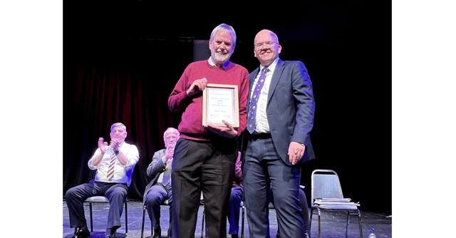 Ardee Senior Band member Kevin Reilly receiving an honorary life membership award