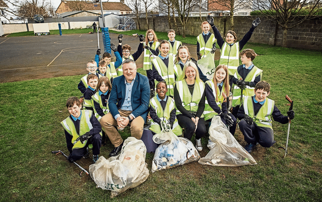 A giant pick-me-up message from Caherconlish NS principal Patrick Ryan; Aoife Butler, teacher and Green School’s co-ordinator, and pupils | PICTURE: Brian Arthur