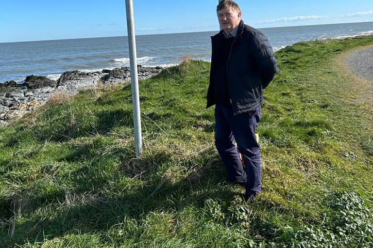 Cllr Pearse McGeough at sign removed with grinders