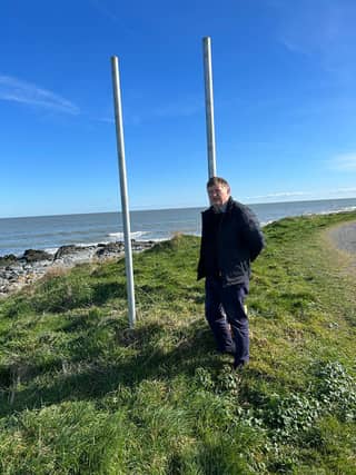 Cllr Pearse McGeough at sign removed with grinders