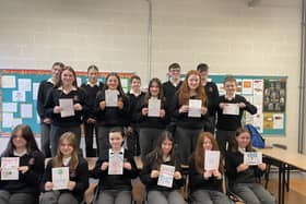 First Year students holding up their Happy Anniversary cards, that they made for ETBI Week.