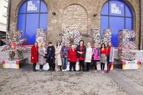 Representatives from Amber Women’s Refuge with local star weaving volunteers who, since 2020, have helped weave over 40,000 stars for the project