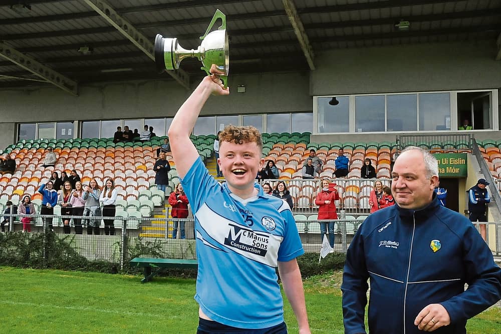 The late Ronan Moran lifts the Cup after he captained Allen Gaels to win the 2020 Leitrim Minor Football Championship title