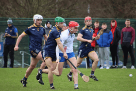 Mary I's Carthach Daly tries to escape the attention of DCU's Richie Lawlor in their Fitzgibbon Cup game. Picture Adrian Butler