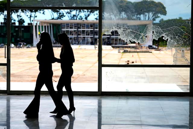 They punched holes in a massive Emiliano Di Cavalcanti painting at the presidential palace and destroyed other works of art.
