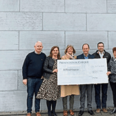 Stryker staff during the cheque presentation to Milford