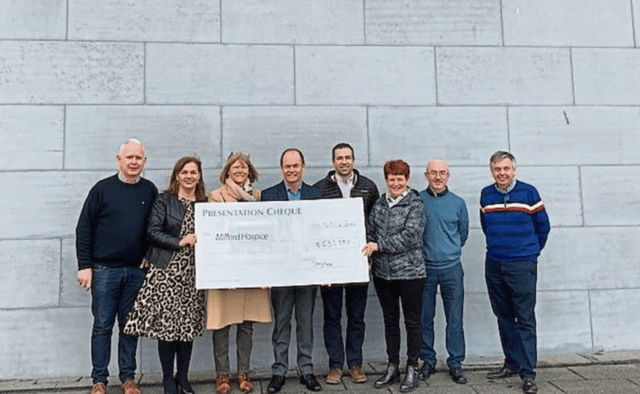 Stryker staff during the cheque presentation to Milford