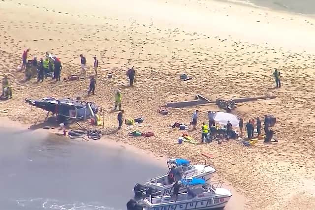 The other helicopter crashed, killing four of those inside and leaving three critically injured.
