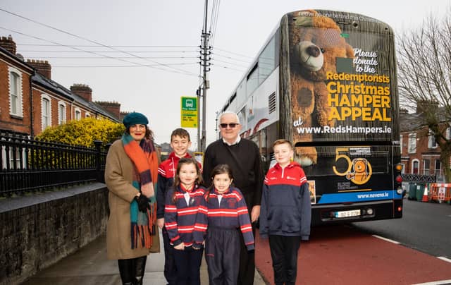 Pictured with Fr Seamus Enright are Marie King and Dylan O'Donnell, Cillian McGrath, Faye Frawley and Grace Geary, | PICTURE: Keith Wiseman