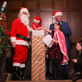 Princess of the Castle Alannah McNulty switches on the Christmas lights together with Santa, his elf and Donal Cox, General Manager at Lough Eske Castle. PHOTOS Siobhan McGowan