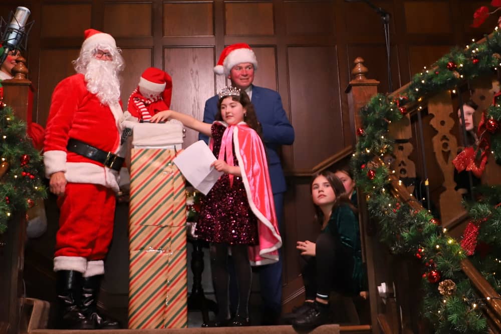 Princess of the Castle Alannah McNulty switches on the Christmas lights together with Santa, his elf and Donal Cox, General Manager at Lough Eske Castle. PHOTOS Siobhan McGowan