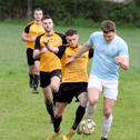 Conor McGrath (Powerstown) under pressure from Kevin Kirwan (Clonmel Town B) in Sunday's Tipperary Cup first round game played on Sunday which Town won by 2-1. Pic: Michael Boland