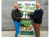 Meaghan Gilmartin, third year Early Childhood Education and Care student at TUS Moylish receiving her iPad from Donn O'Sullivan Head of Marketing and Communications at Limerick City and County Council