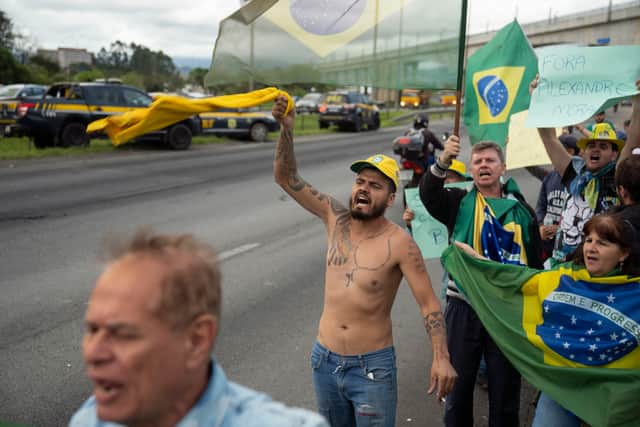 “I have always been labelled as anti-democratic and, unlike my accusers, I have always played within the four lines of the constitution,” Mr Bolsonaro, flanked by more than a dozen ministers and allies, told reporters in the official residence in the capital Brasilia.