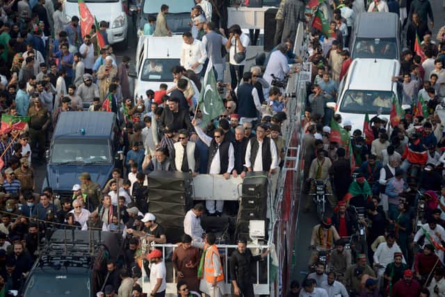 Pakistan’s ex-PM Imran Khan pauses protest march after shooting