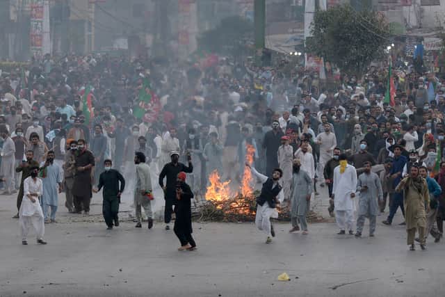 Pakistan’s ex-PM Imran Khan pauses protest march after shooting