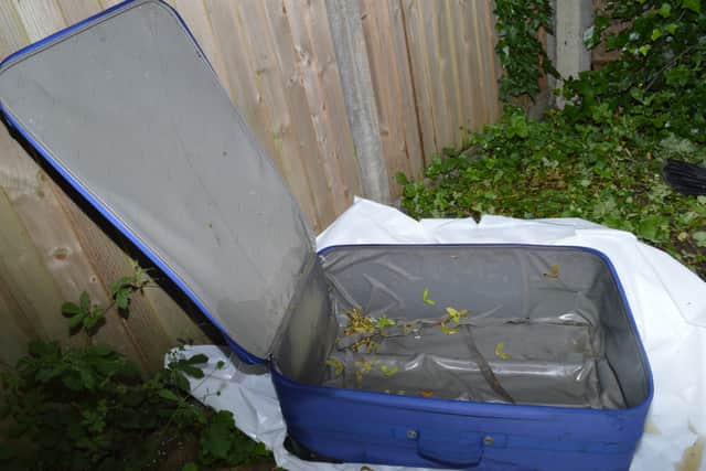 The blue suitcase had been stored on the roof of a neighbour’s shed.
