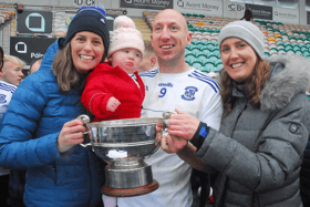 James McGrail pictured with his wife Carmel, daughter Eabha and sister Clodagh and the Fenagh Cup after St Mary's victory last Sunday Picture: Willie Donnellan
