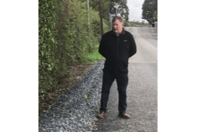 Cllr Pearse McGeough at road in Killanny after road repaired