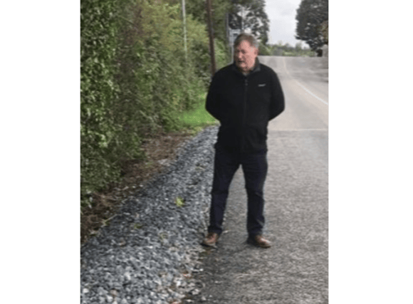Cllr Pearse McGeough at road in Killanny after road repaired