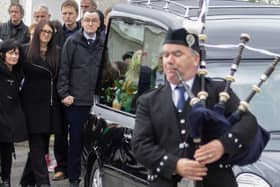 A lone piper leads the funeral cortege of Martin McGill PHOTO: NORTHWEST NEWSPIX