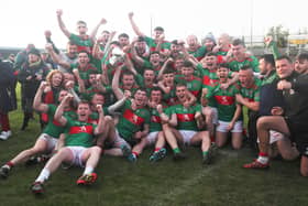 The thrilled Colmcille players celebrating with the Connolly Cup following the dramatic win over Mullinalaghta in the county SFC final Photo: Syl Healy