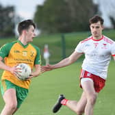 Harry Butterly of Stabannon taking on John Mitchels Andrew Bingham in Friday night's Dkit Sport Junior Champonship game in Darver. Pic: Arthur Kinahan