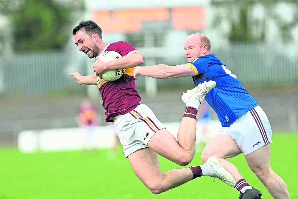 Pauric Gill on the attack for Fr Manning Gaels in his bid to evade the challenge of Kenagh defender John Gill. Action from the IFC semi-final on Saturday evening Photo: Syl Healy