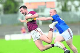 Pauric Gill on the attack for Fr Manning Gaels in his bid to evade the challenge of Kenagh defender John Gill. Action from the IFC semi-final on Saturday evening Photo: Syl Healy