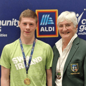 All-Ireland champion Killian Whelan  won gold  in the u16 breaststroke at the National Community Games finals.  He is pictured here with Mary Haughney, President of Swim Ireland.