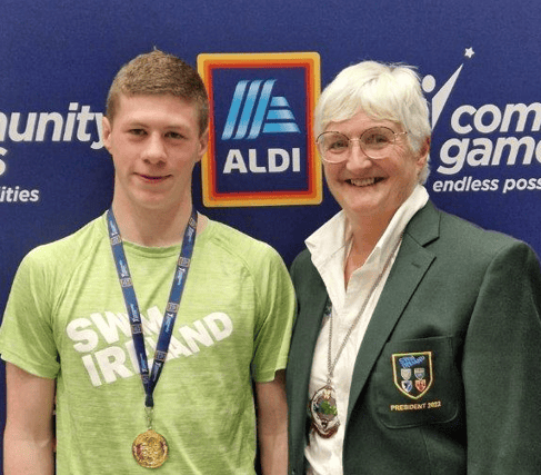 All-Ireland champion Killian Whelan won gold in the u16 breaststroke at the National Community Games finals. He is pictured here with Mary Haughney, President of Swim Ireland.